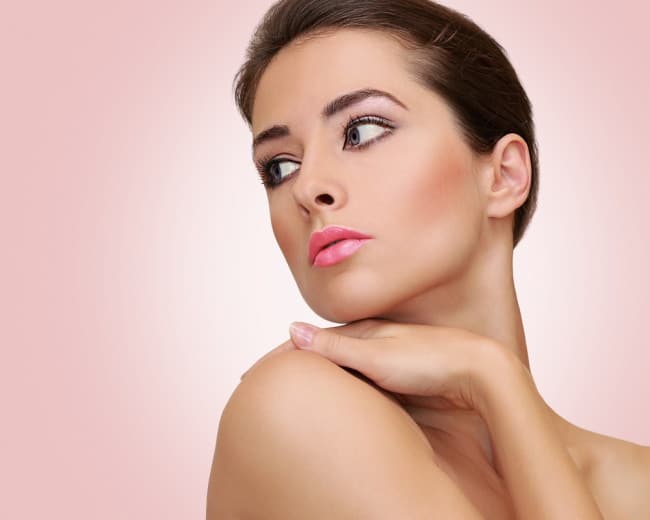 Beautiful woman with health skin looking on empty space. Closeup Powerful and safe skin care products